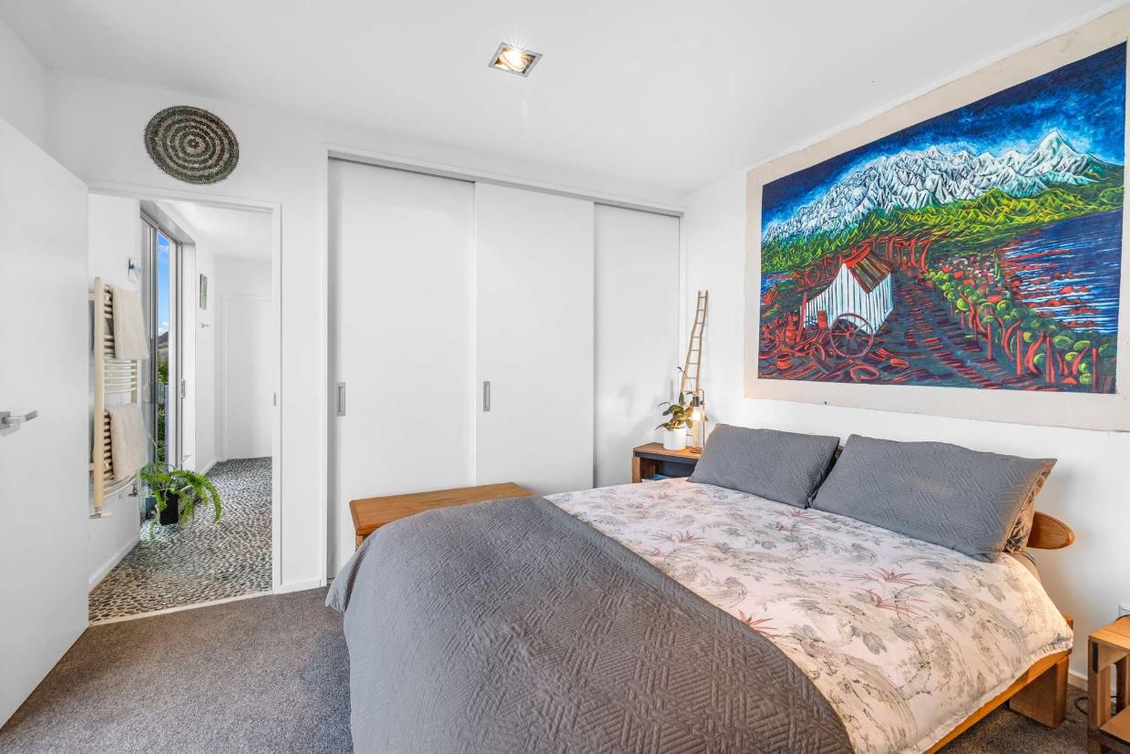 The home has three bedrooms. One of the bedrooms is pictured