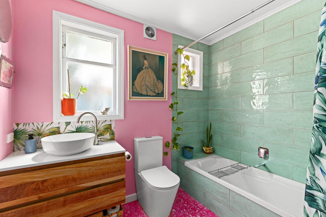 Pink and green feature in this bathroom, one of three in the house.