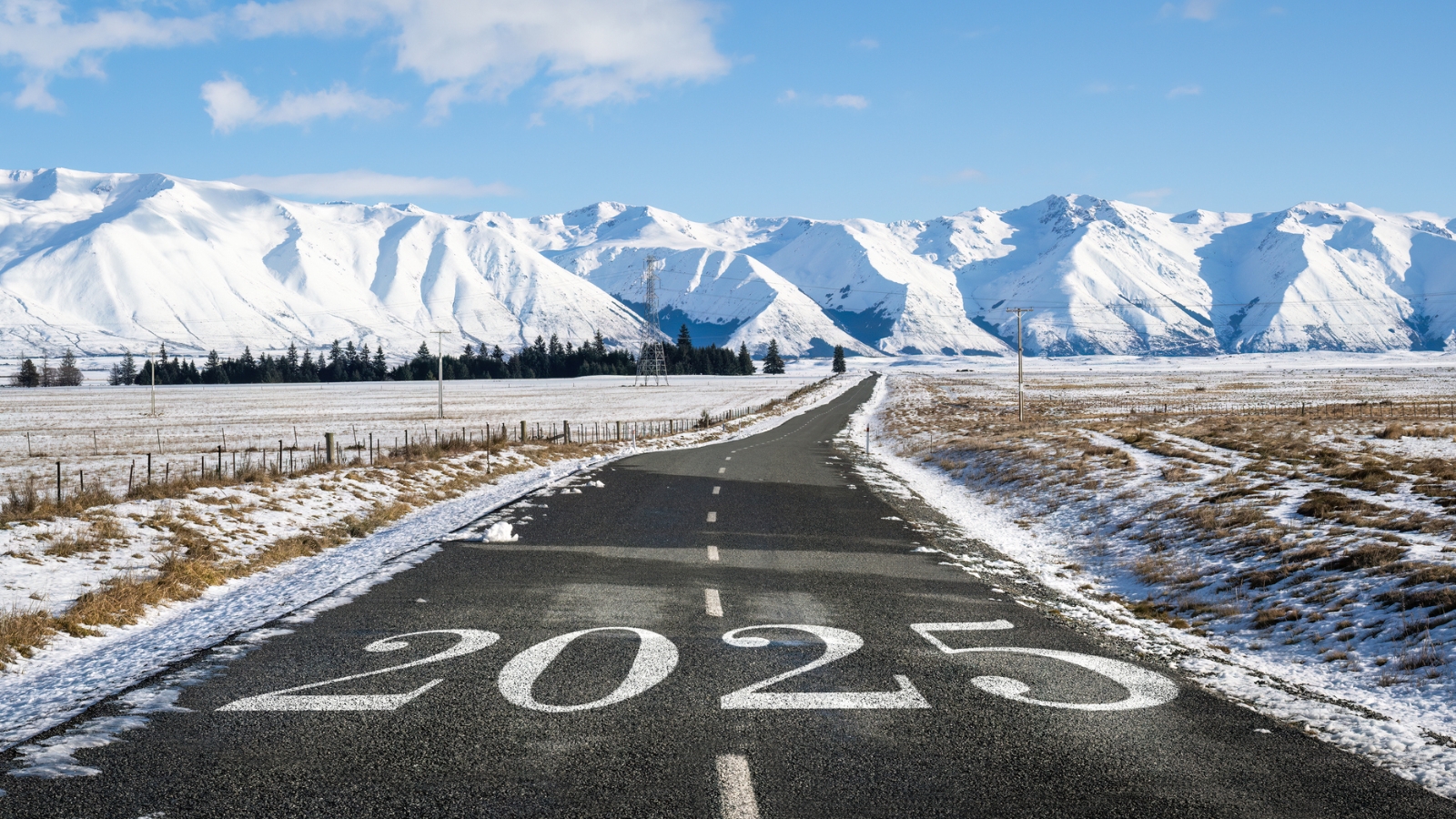 Road with 2025 on it and mountains. 