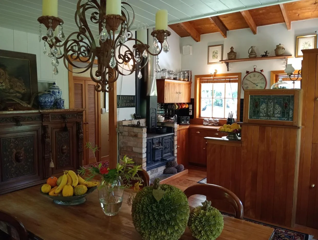 The interior was hand-crafted in native hardwoods. Pictured is the kitchen.