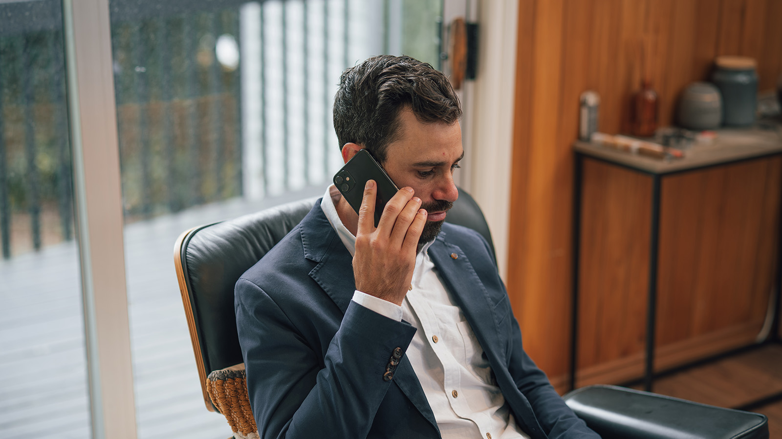 Man on the phone to his mortgage broker