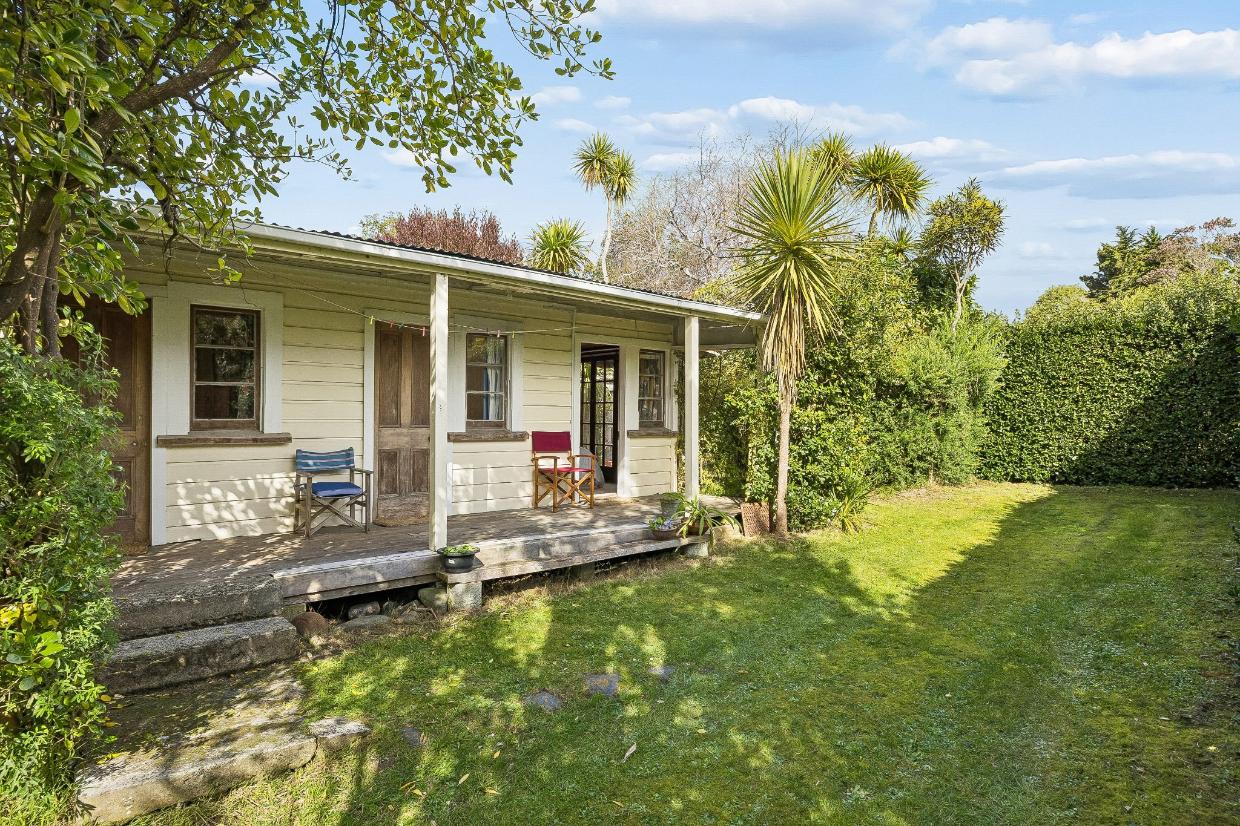 Almost everything is original, including the concrete steps down to the lawn. The section is 840m². Photo: Nidd Realty