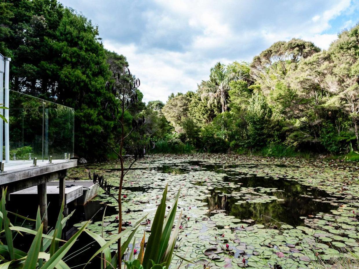 The home overlooks a fish pond