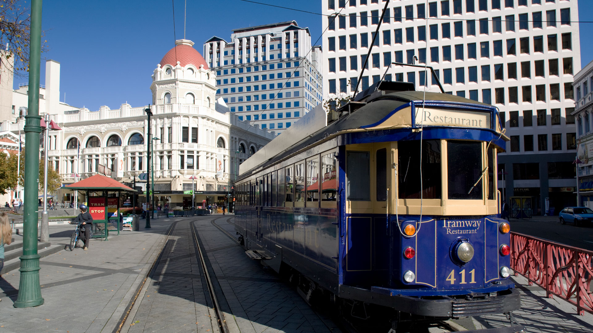 Photo of a blue street tram in Christchurch city.