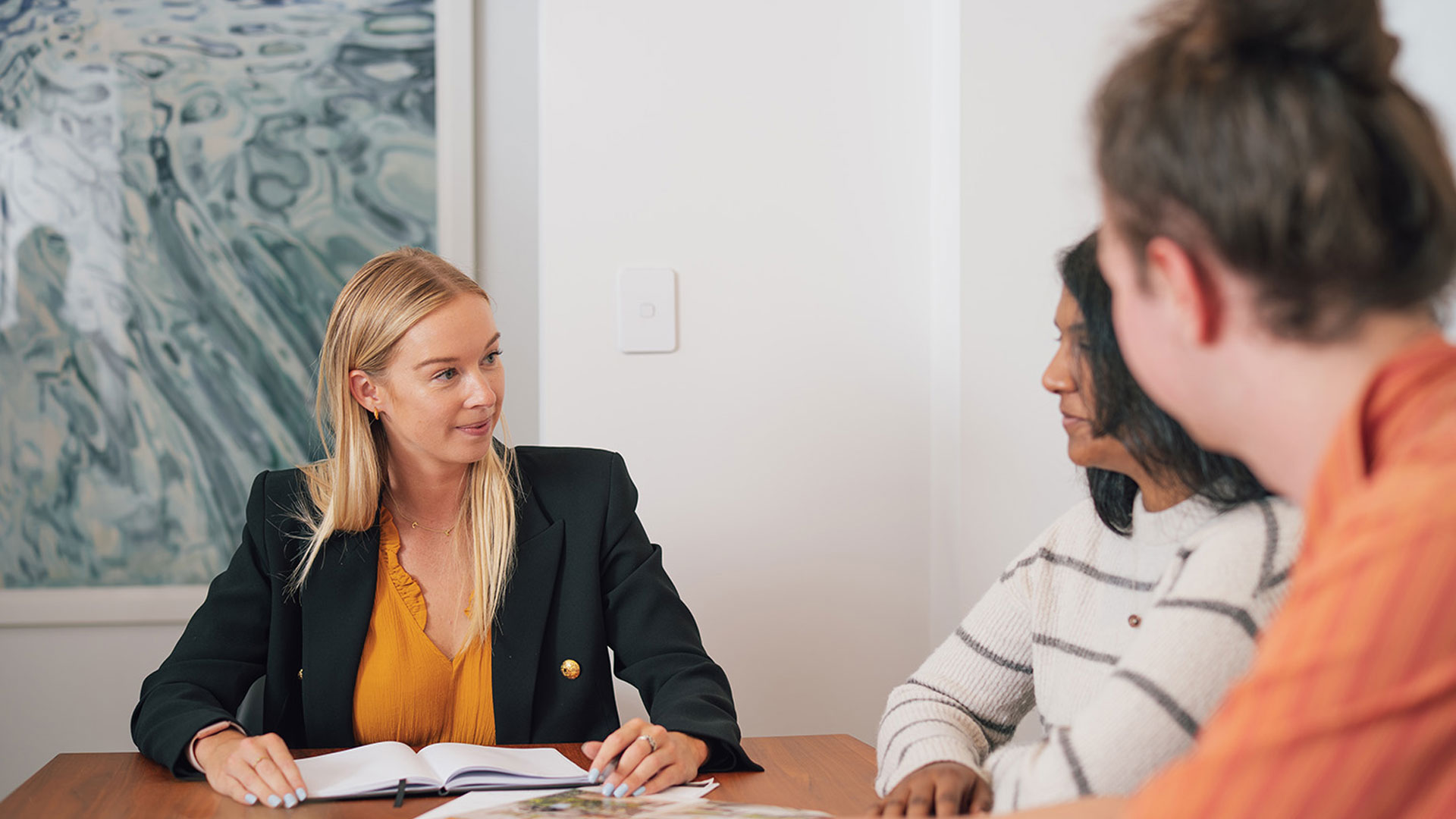 Couple discussing their NZ home loan options with a mortgage broker.