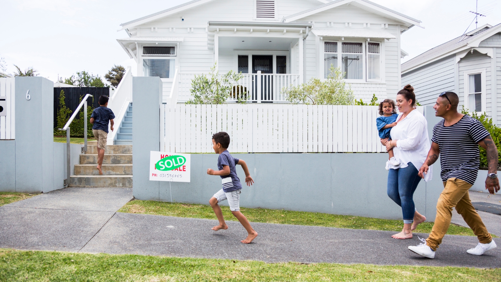 Family running into home. 