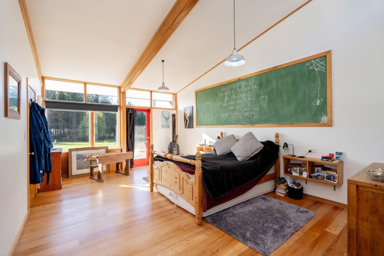 Original chalkboard sits in a bedroom.