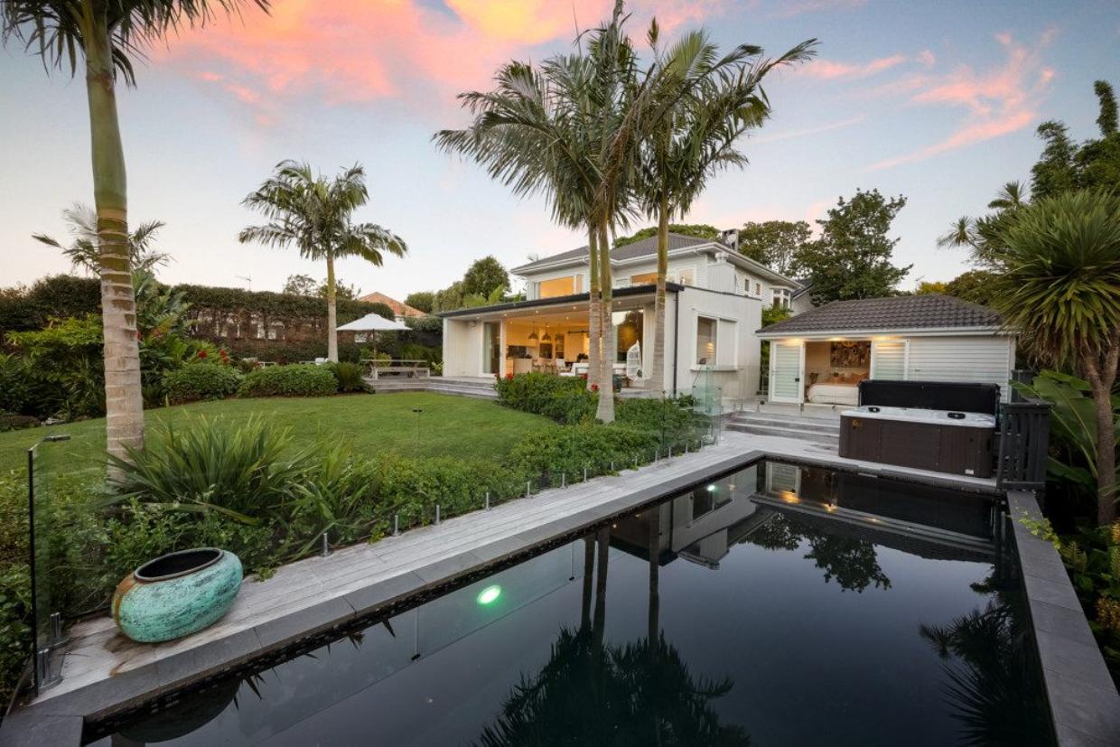 The home looks like a standard bungalow at the front - and a luxury resort at the back.