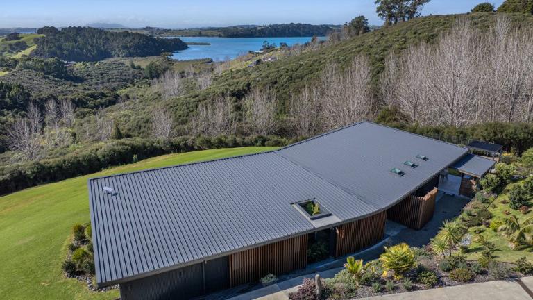 The house is nestled into the landscape. Photo: HARCOURTS/ TRADE ME