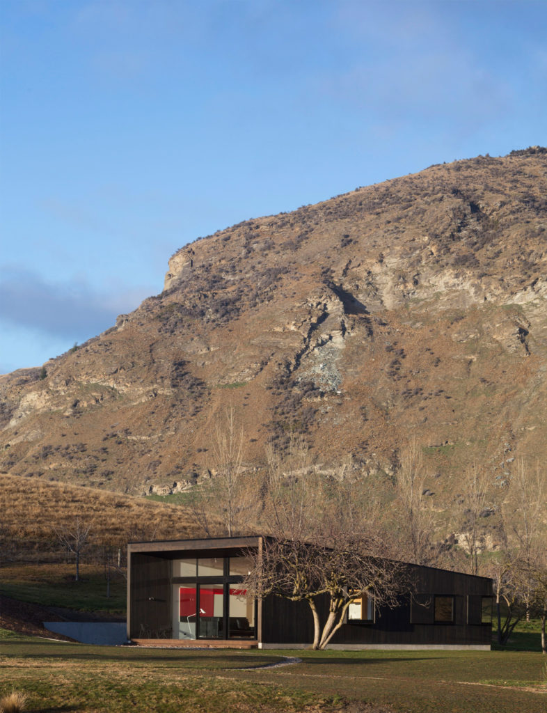 A contemporary Queenstown alpine cottage with mountains in the background