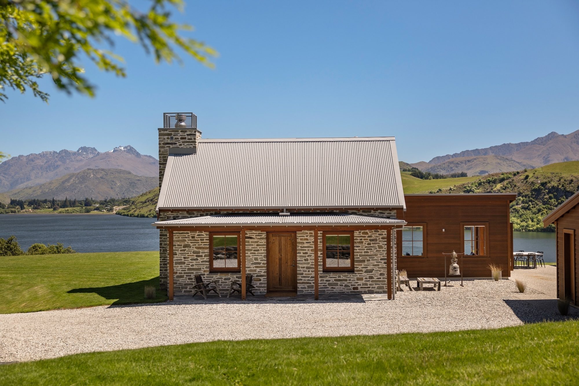 Charming stone cottage nestled by a tranquil lake, surrounded by nature with peaceful water views and a cosy, rustic feel. 