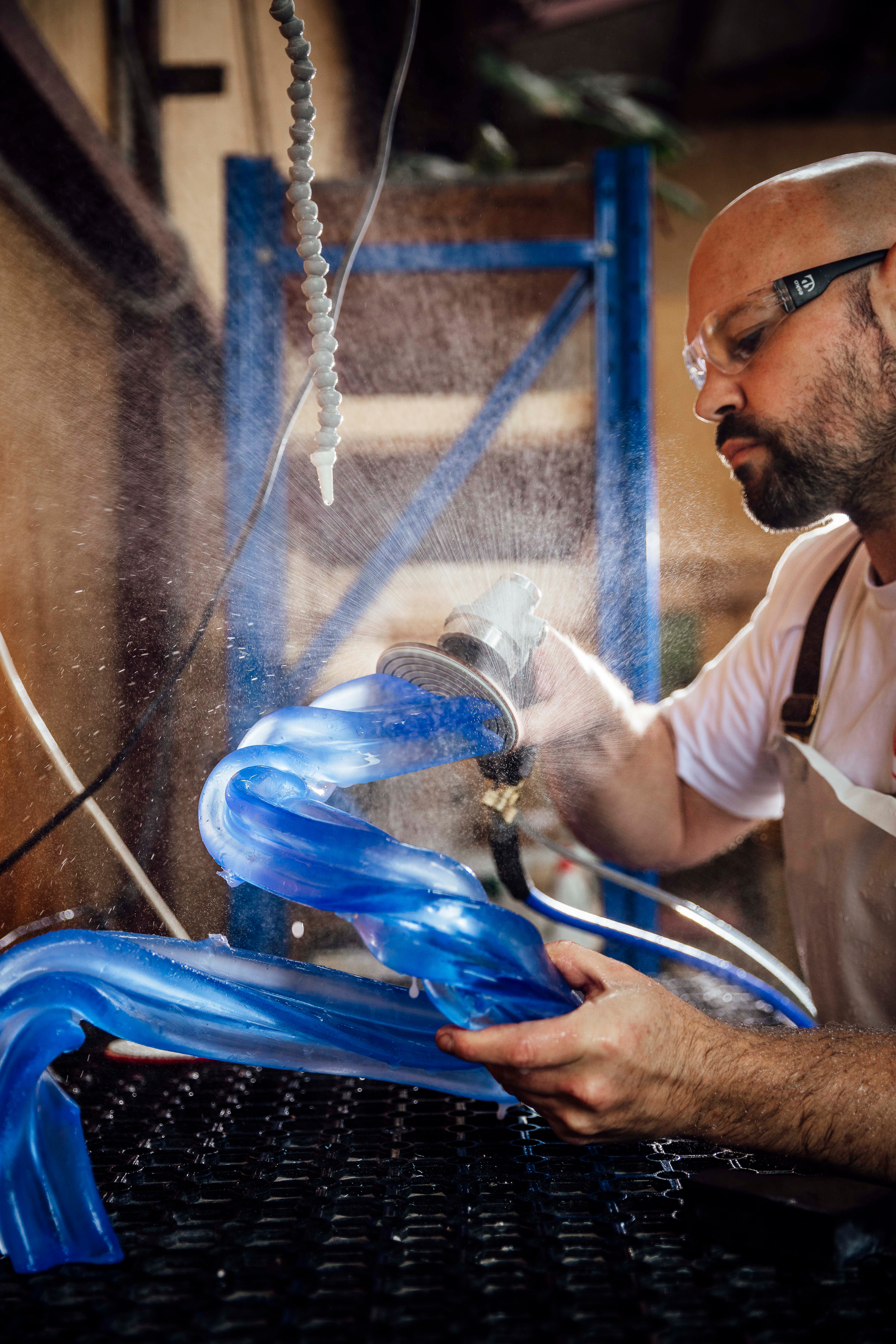 Simon sculpting blue glass