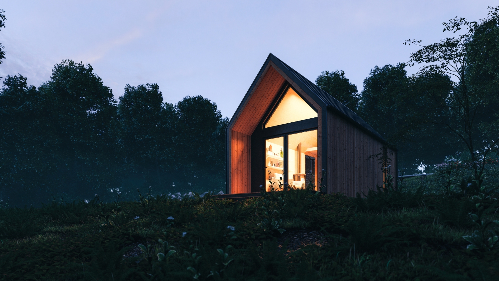 Tiny house lit up at night. 