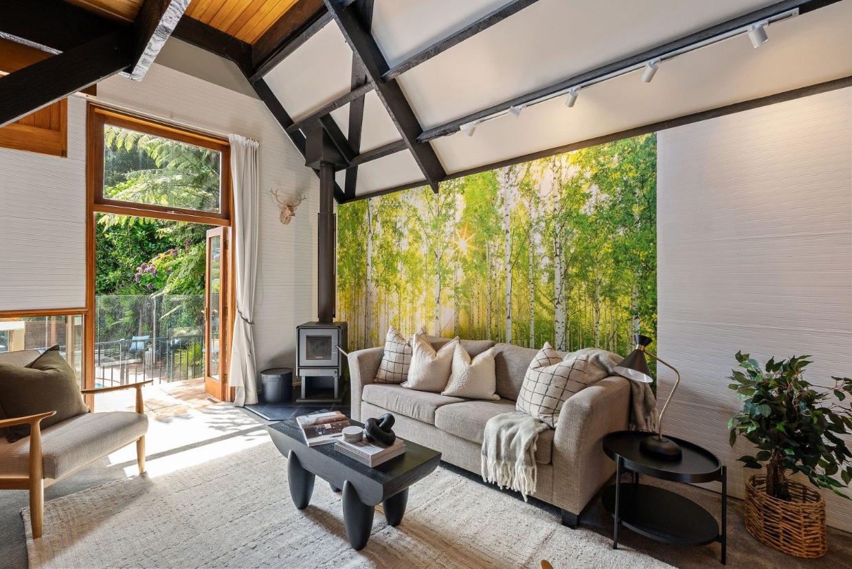 The home has two reception rooms, this is the upper living room. 