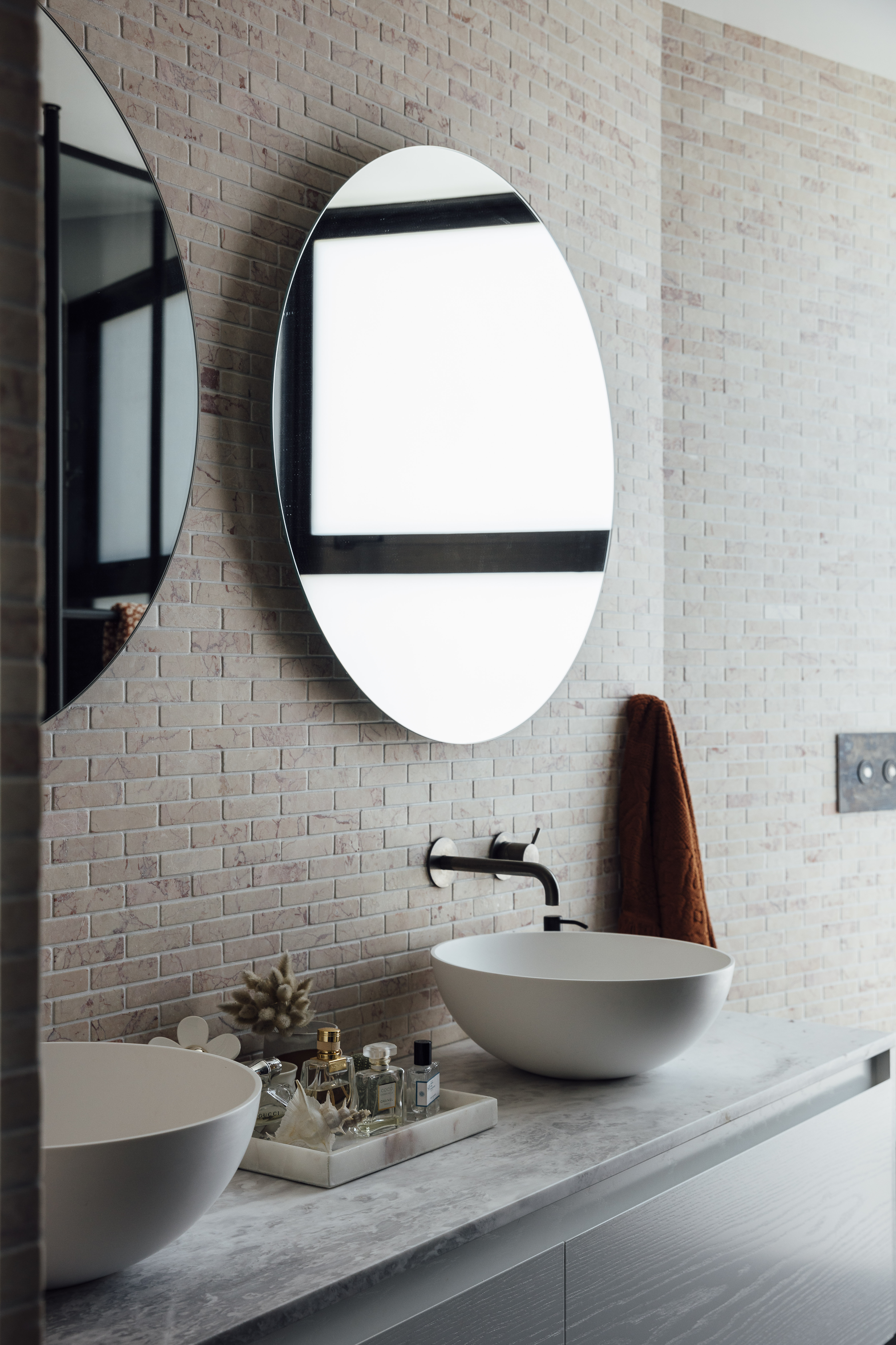Pink marble tiled ensuite.