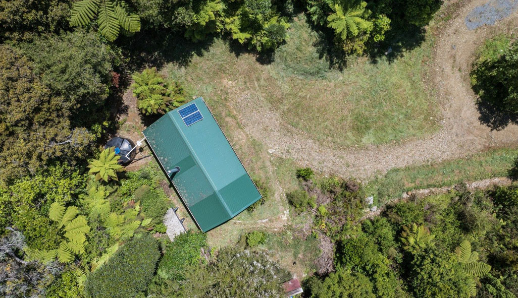 An aerial view of an off-grid property for sale in a remote part of Tākaka.