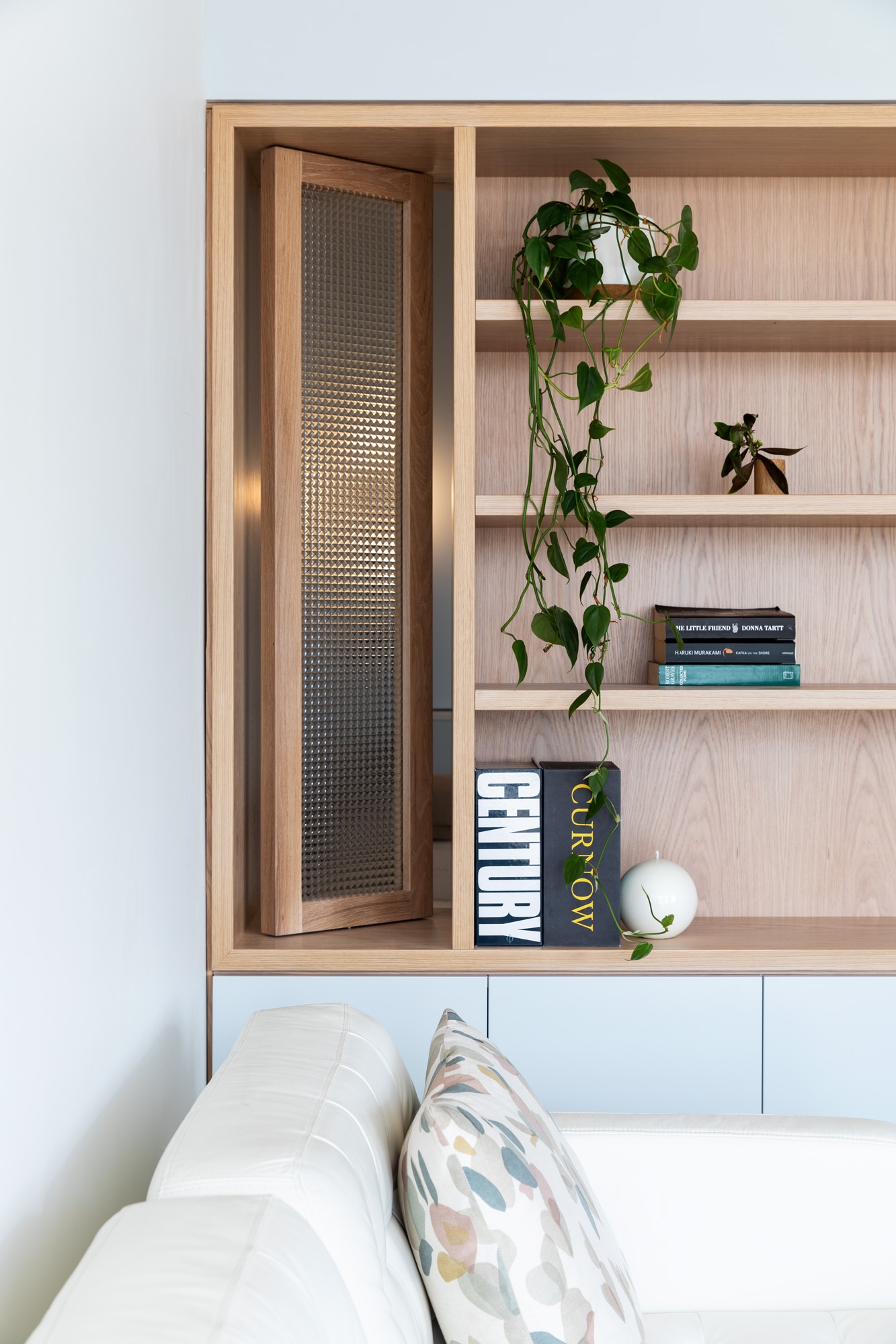 Integrated cabinetry creates a space for books and other personal items to be displayed without taking up valuable floor space in a home by LeLa Architects. Image: Larnie Nicolson