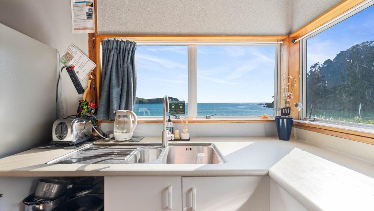 “Doing the dishes” is no hassle with this view. Photo: Bayleys