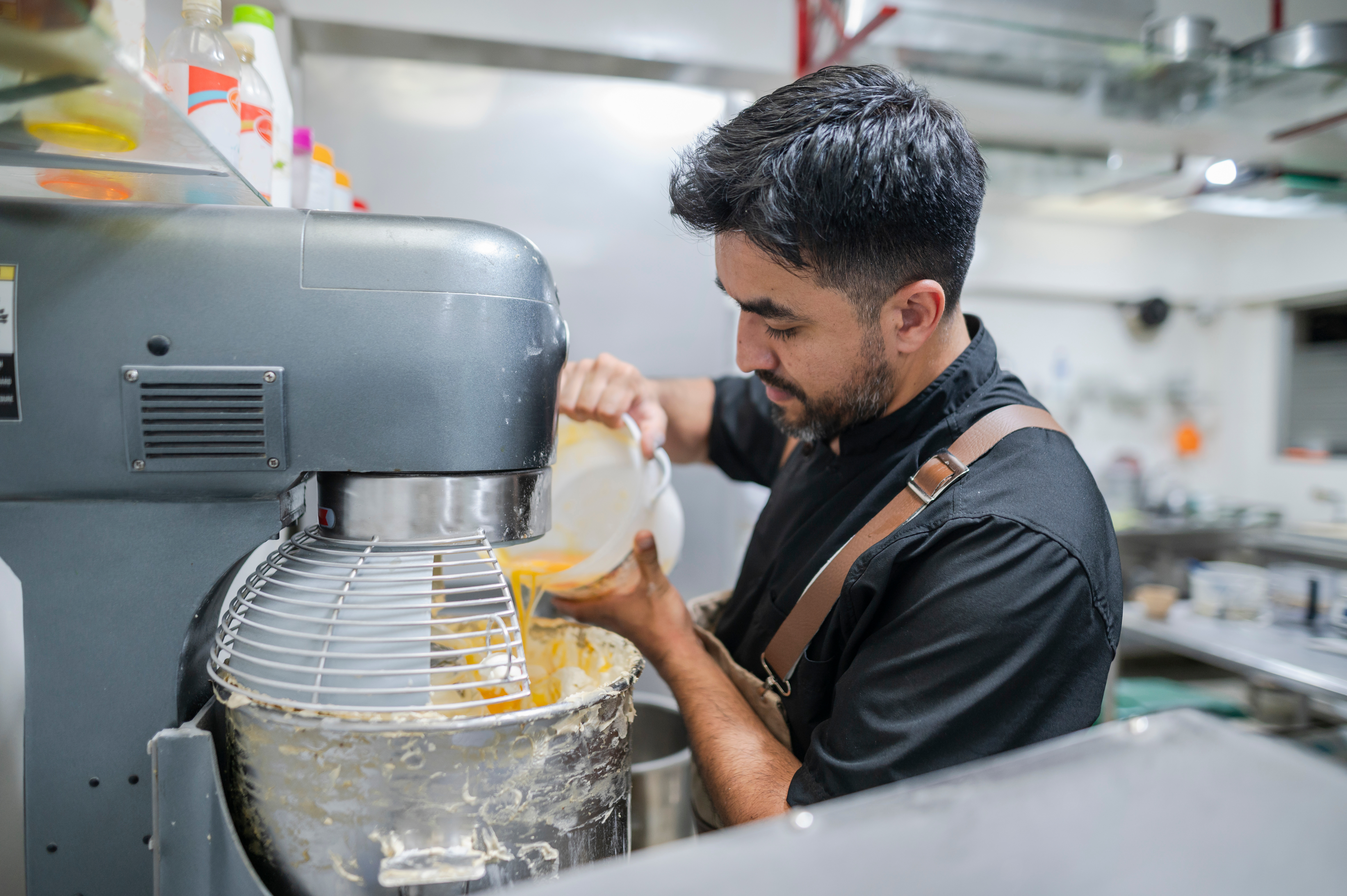 Male baker baking in the kitchen.