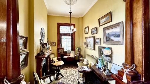 The home has six sitting rooms and a study, which has its own fireplace. Photo: TRADE ME/ONE AGENCY