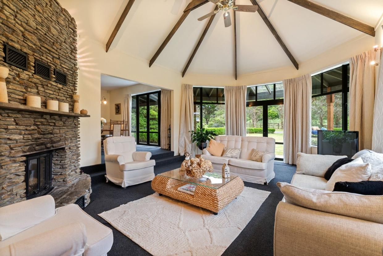 The home boasts a magnificent schist fireplace.