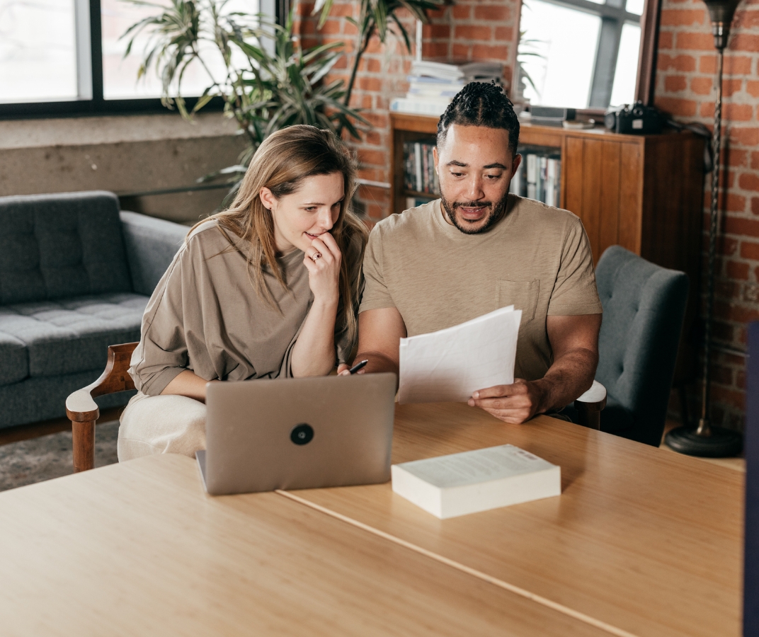 Couple looking at laptop. 