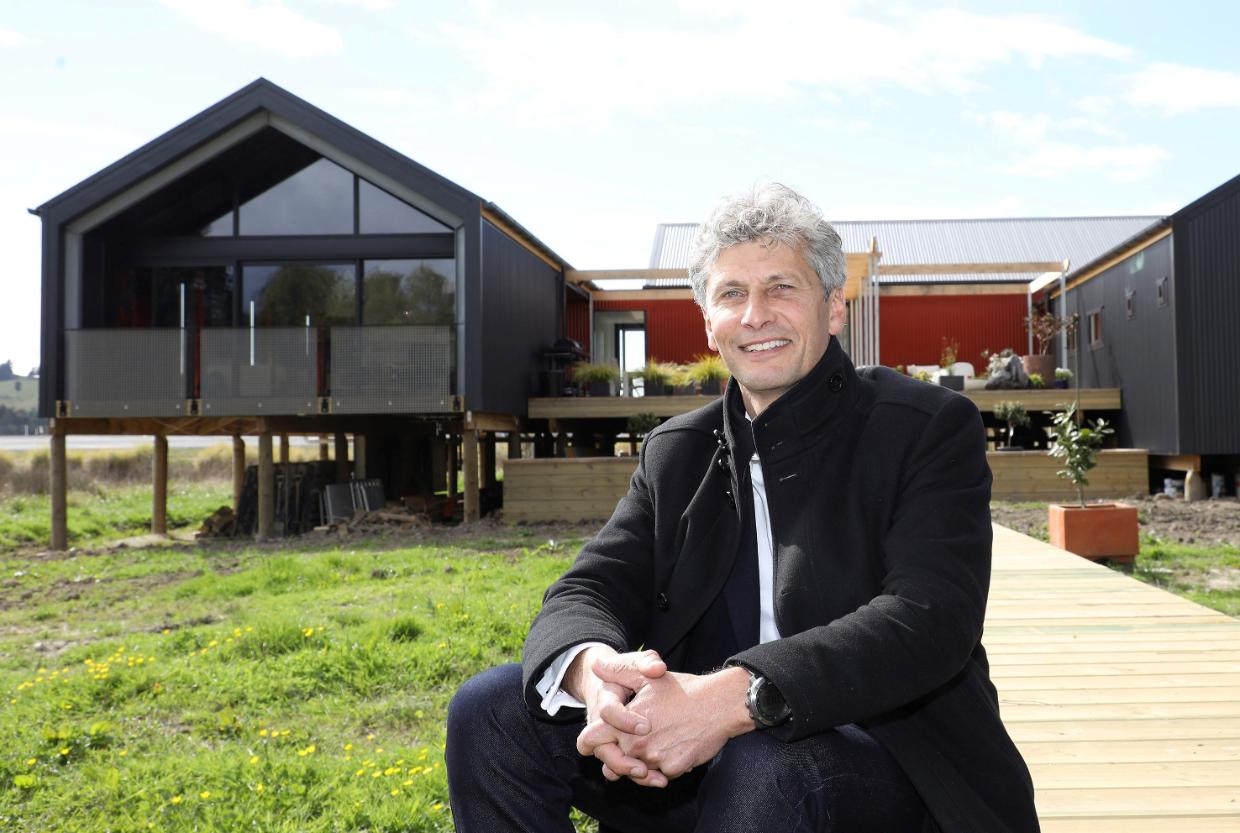 Flashback: Architect Chris Moller outside the newly built house - he was the presenter of Grand Designs NZ in 2017. 