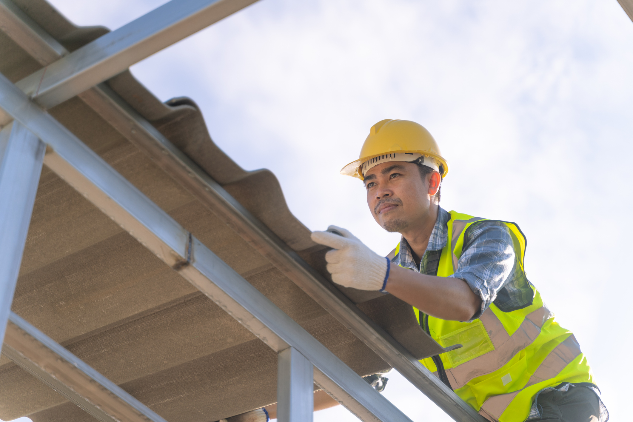 Male roofer working on a roof