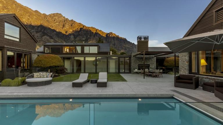 The house includes a gym, a pool, and a steam room.