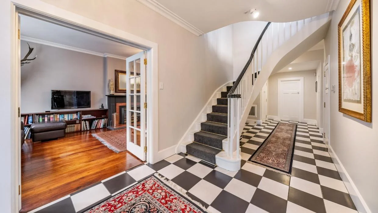 Photo of formal entry hall with living areas off both sides