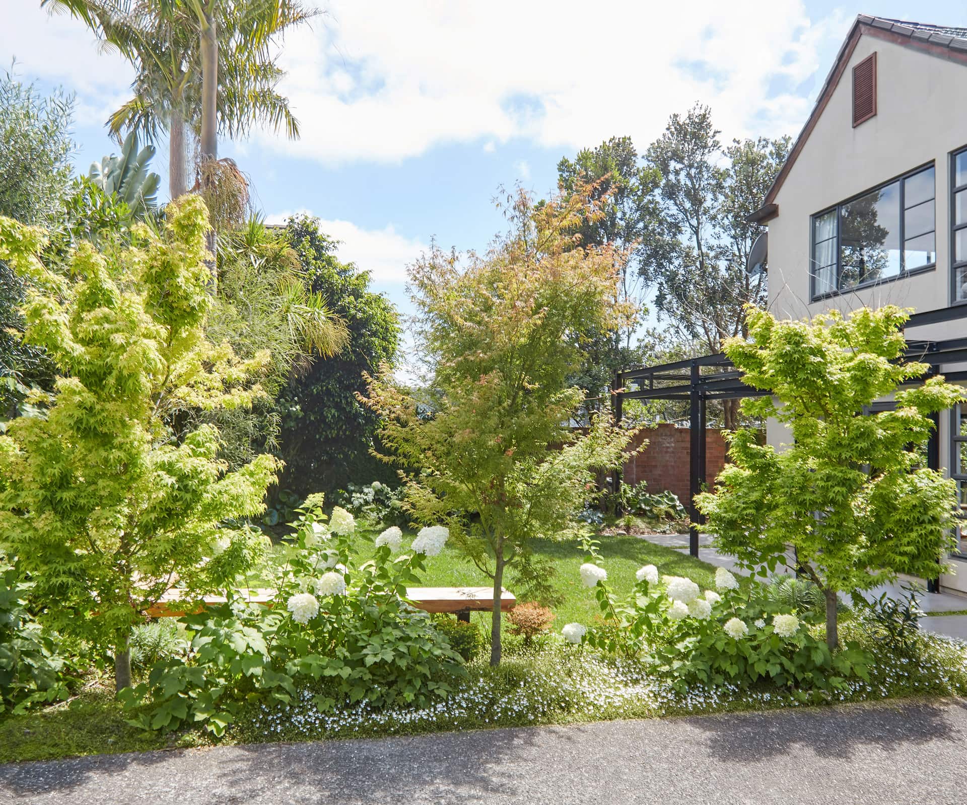 Faced with a narrow garden and dated exterior, James Walkinshaw of Xanthe White Design used some simple but effective ways to transform this Pt Chev home.