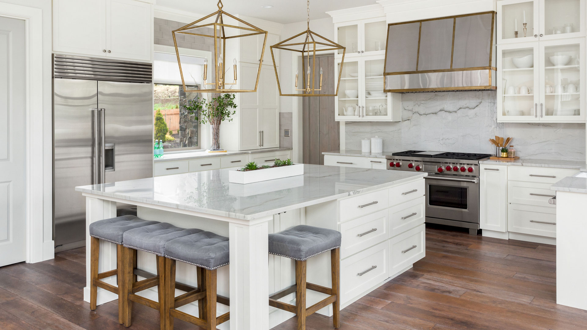 A NZ kitchen with a large island in the centre.