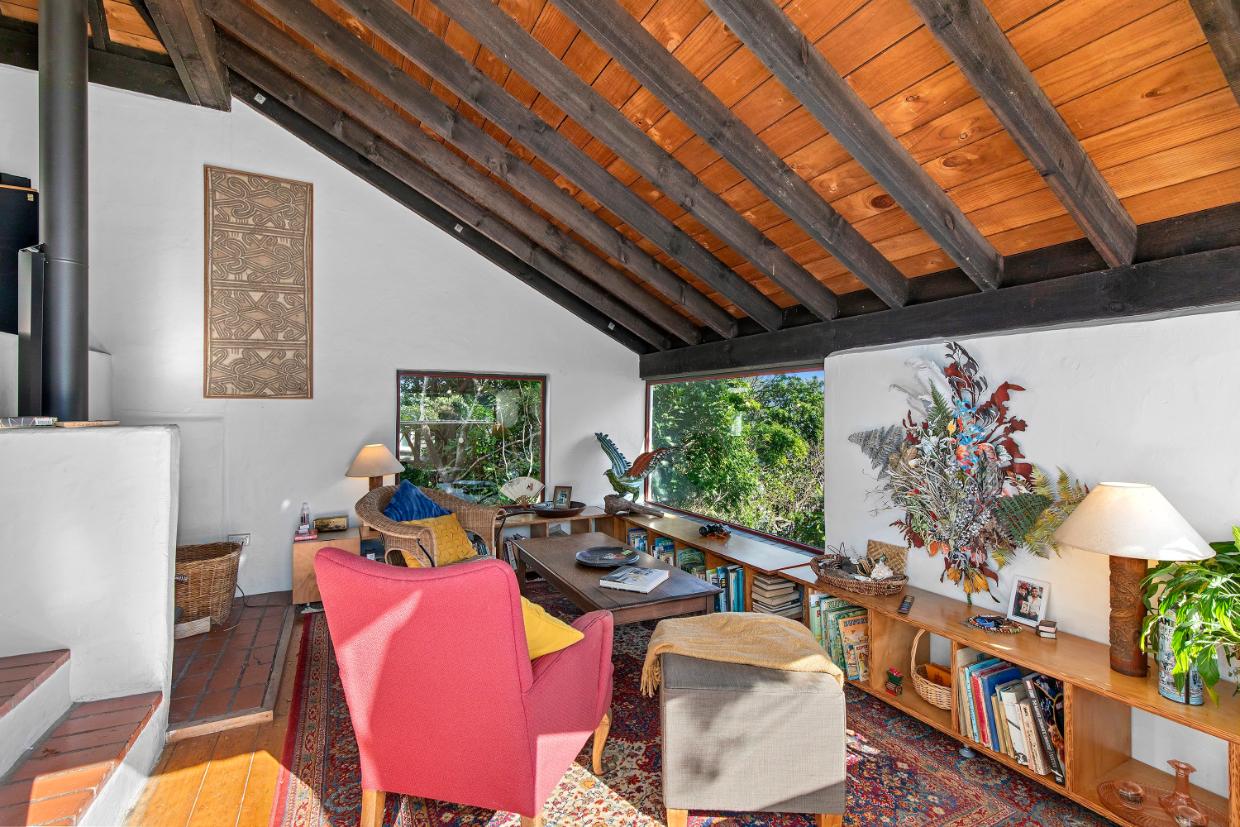 The “sunken” living room has harbour views in Lower Hutt