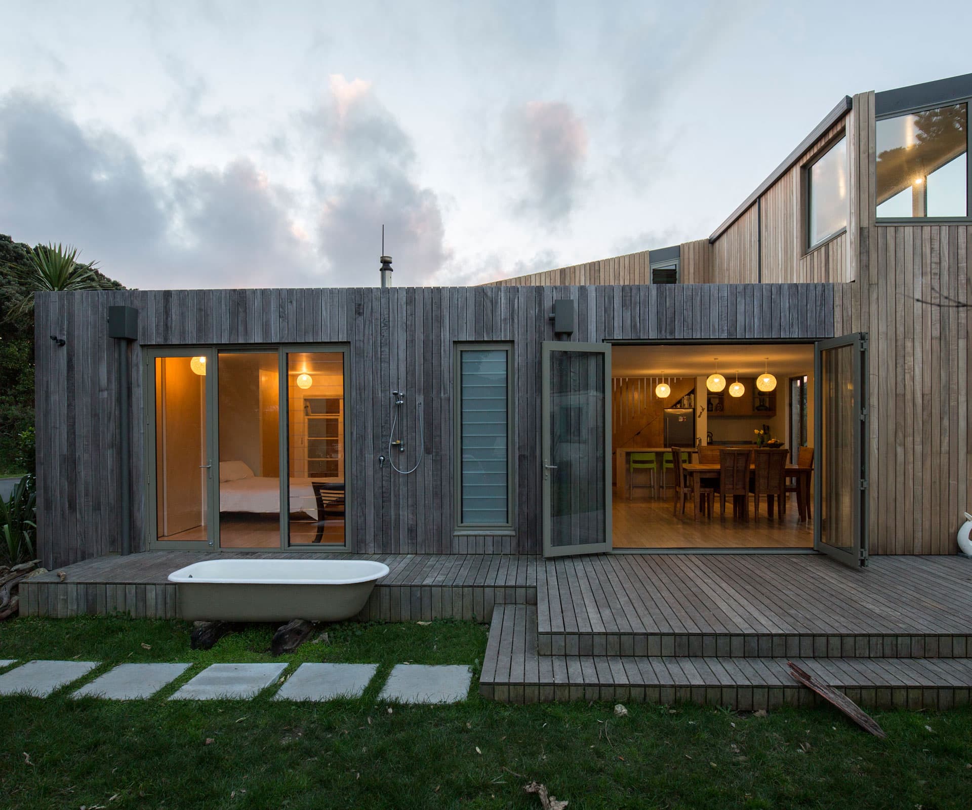 1950s stucco house in Paekākāriki transformed into a modern weatherboard family home.