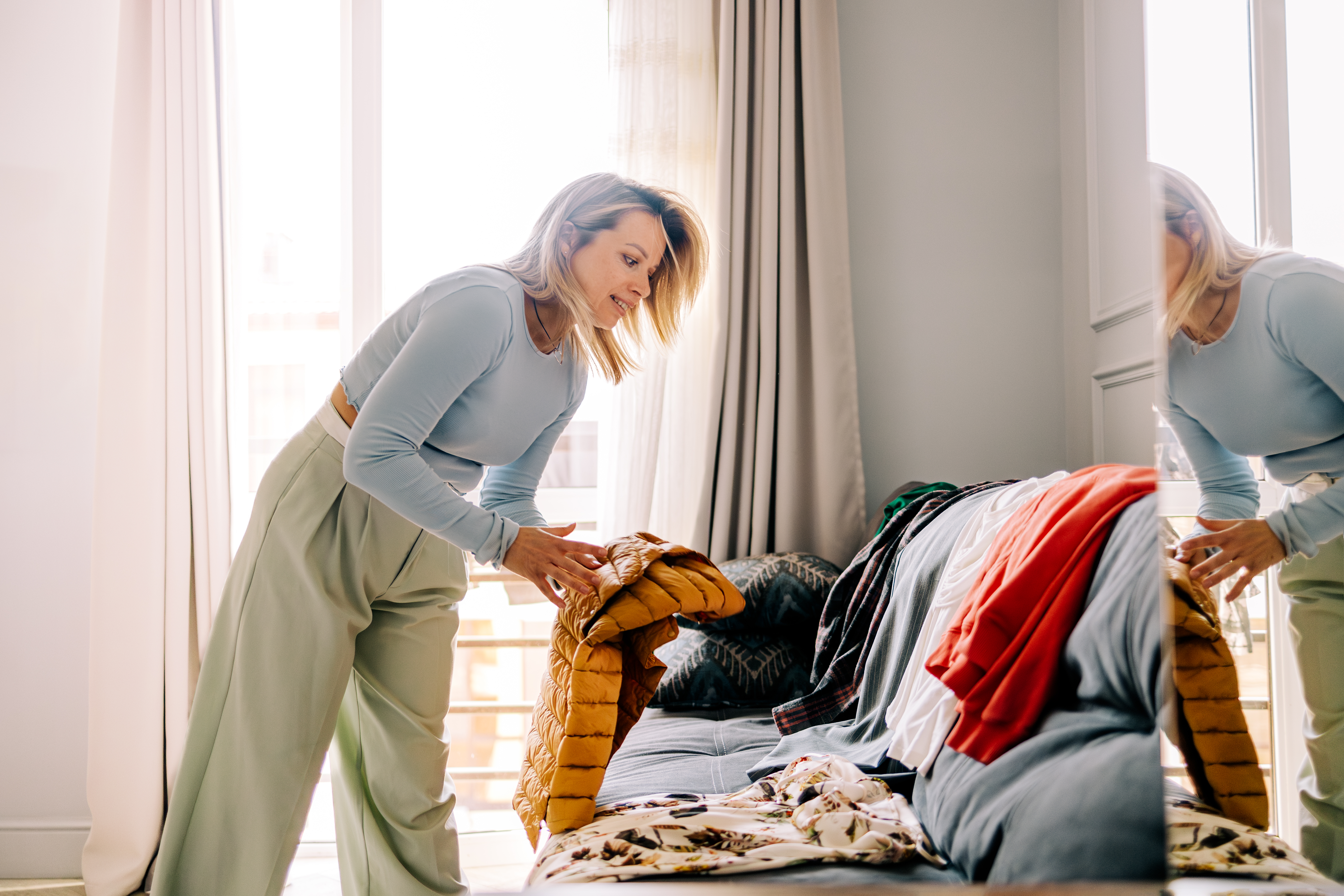 A woman decluttering her wardrobe