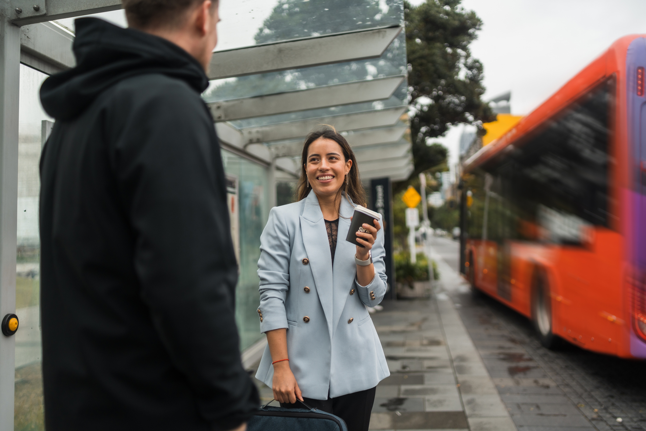 Image of woman at a bus stop