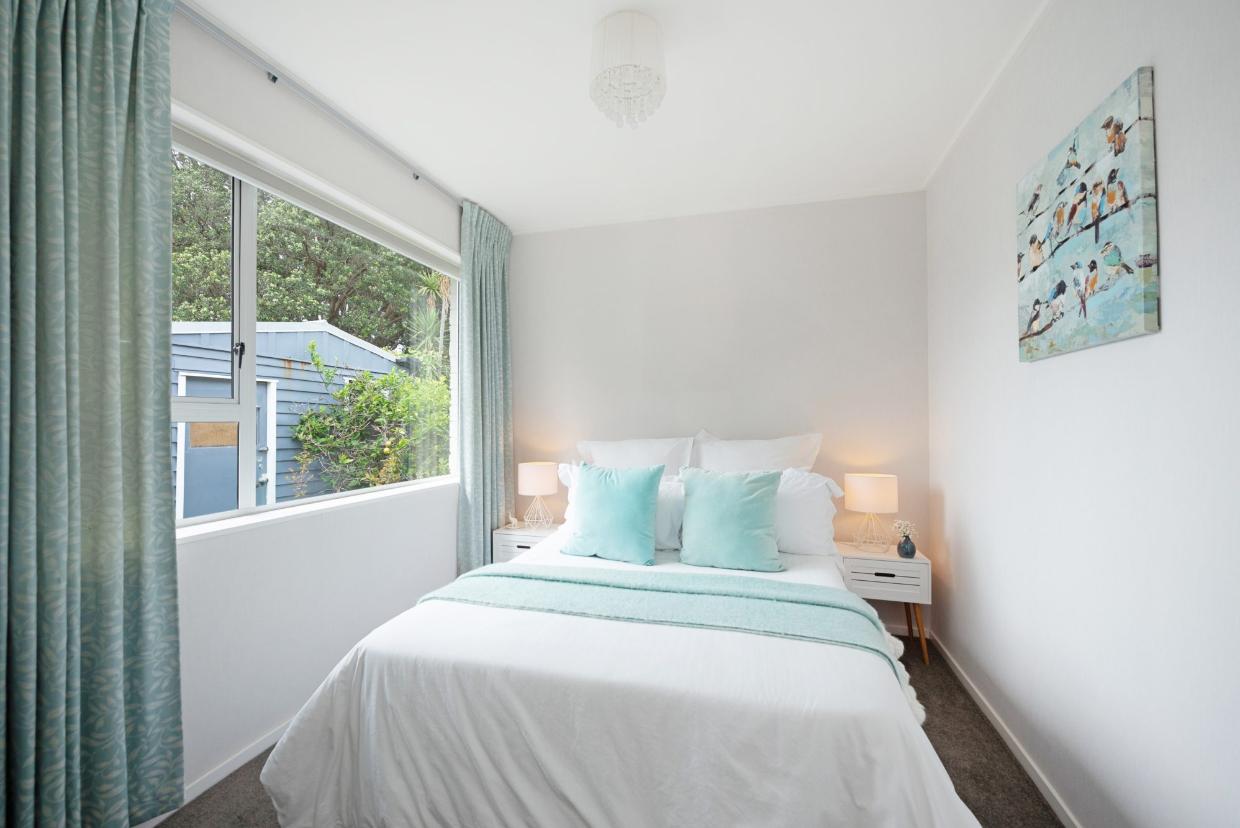 The light and bright second bedroom. 