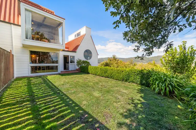 View of the grass and outdoor area of the home.