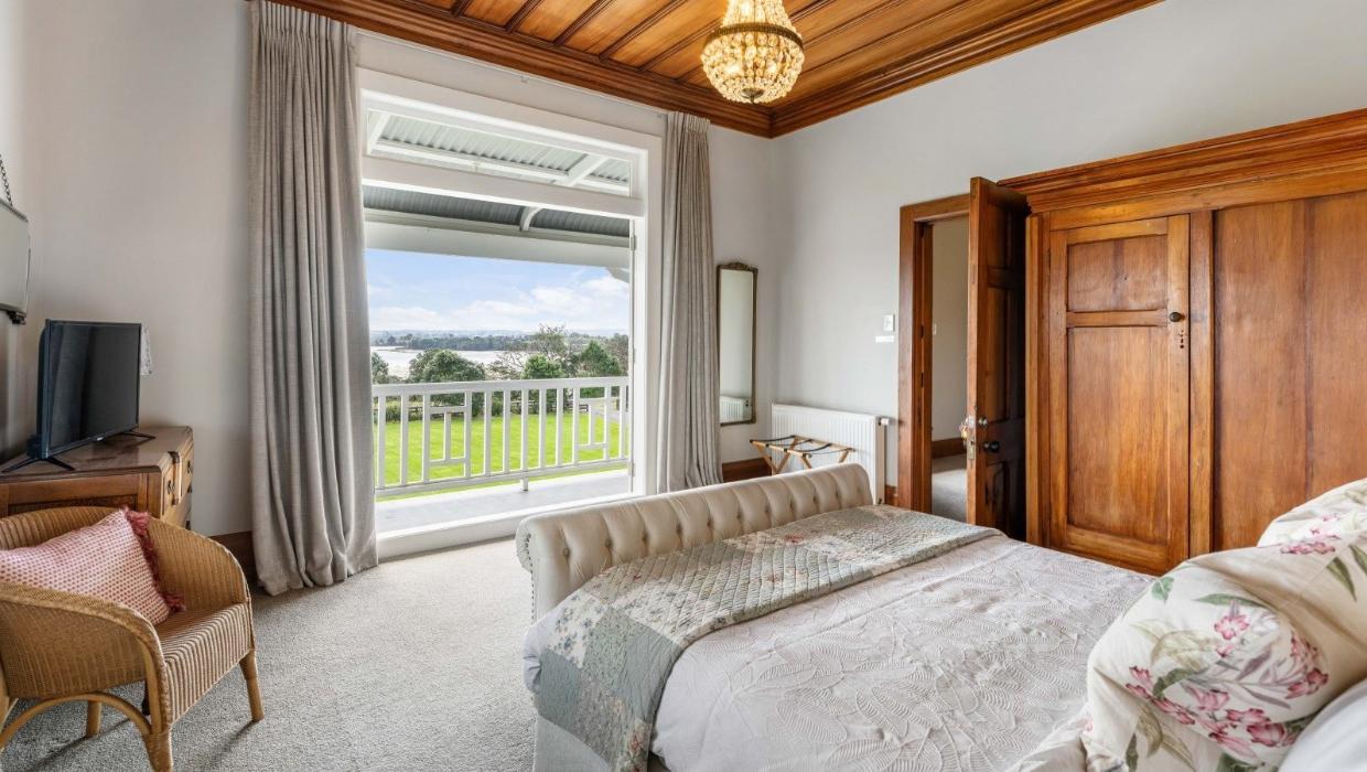 The bedroom opens out to a veranda. 