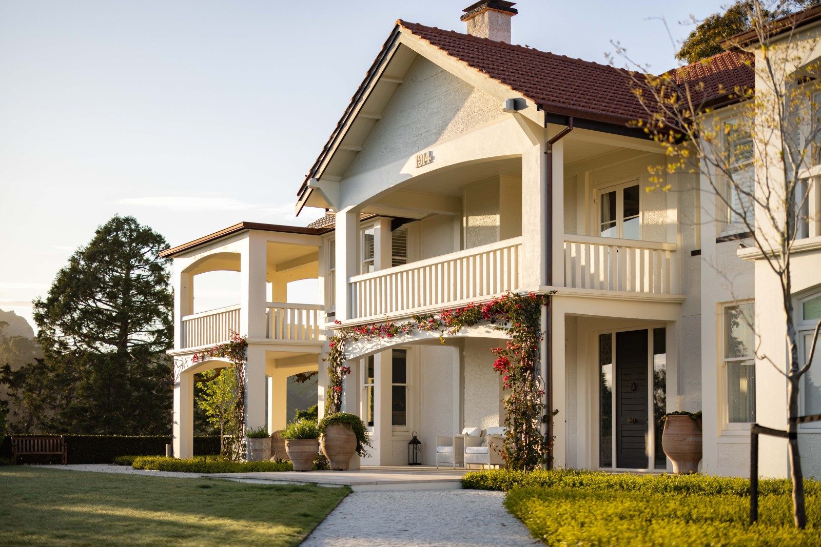Heritage-style two-storey home with verandahs, bougainvillea and manicured gardens at 152 Kopanga Road, Havelock North