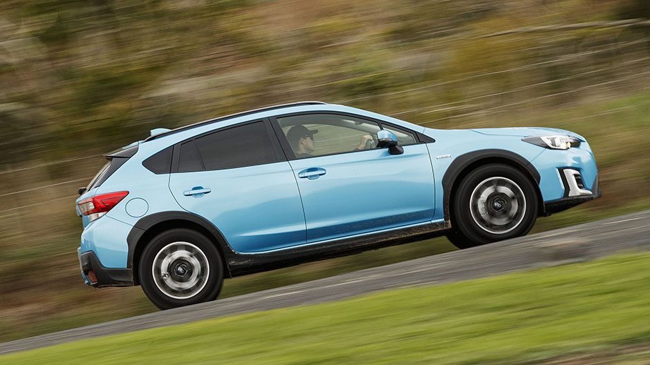 blue subaru xv e-boxer side action