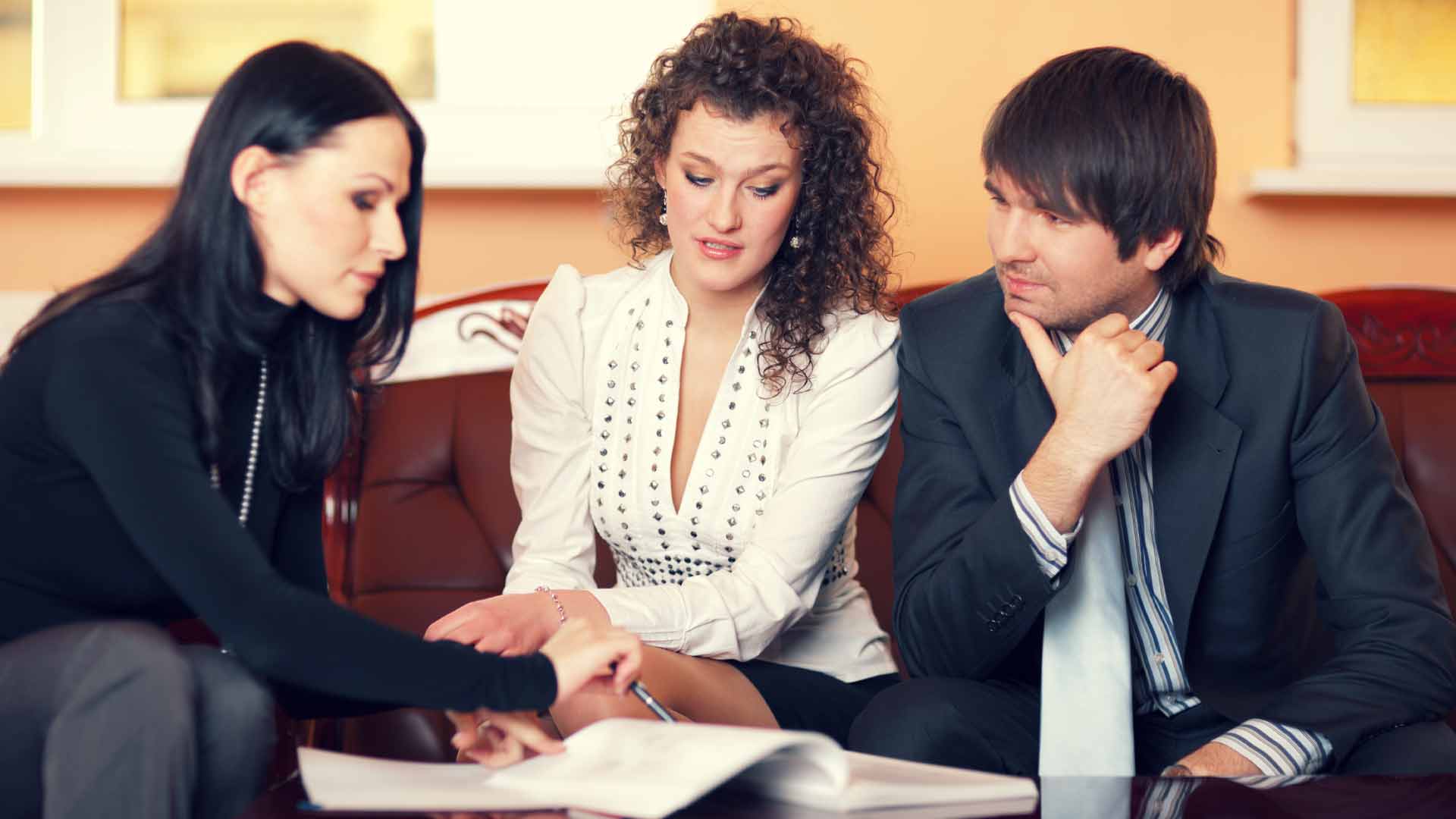 Couple consulting a NZ mortgage broker.