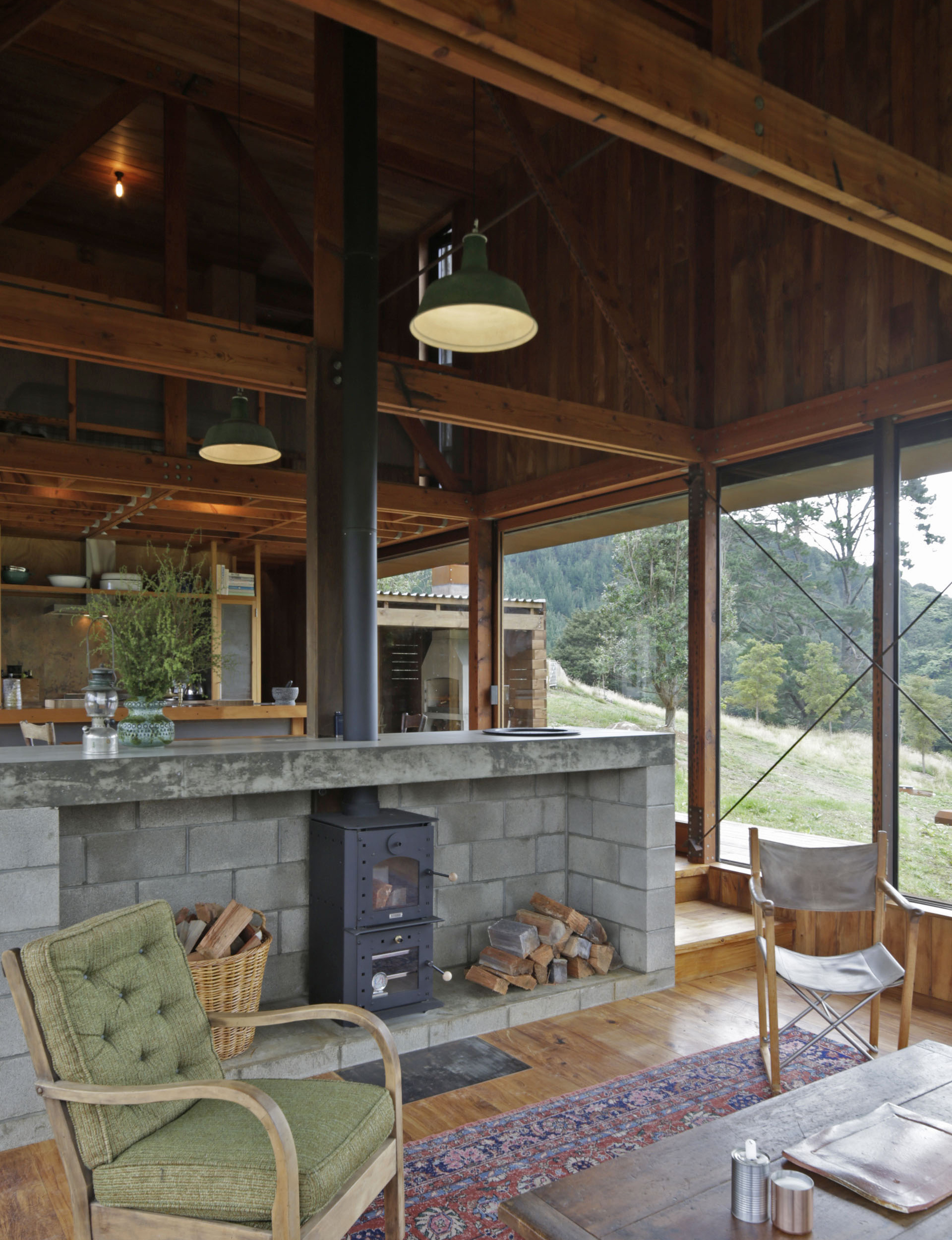 Living room with a small fireplace sitting in a frame of concrete bricks