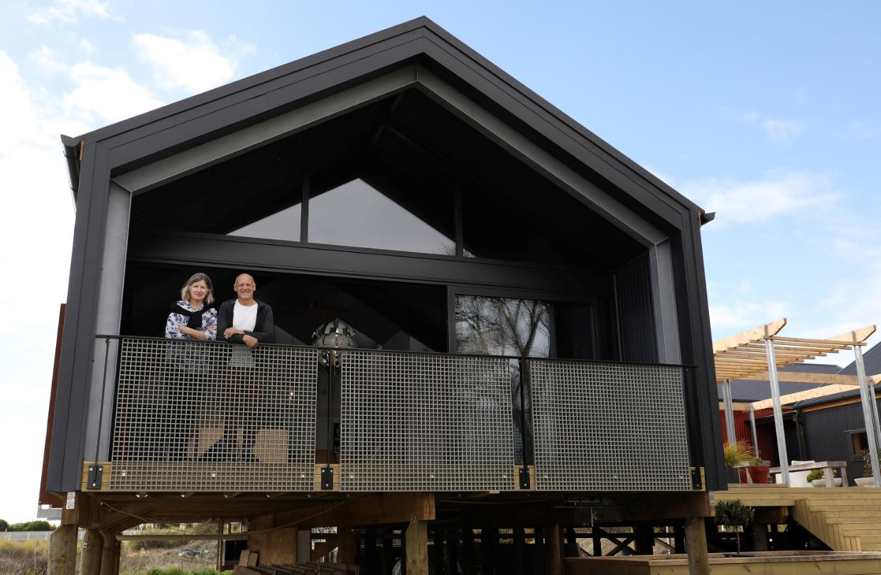 Flashback: Yvonne and George Hilgeholt were photographed on the deck of the house, which George built himself. Photo: MEDIAWORKS