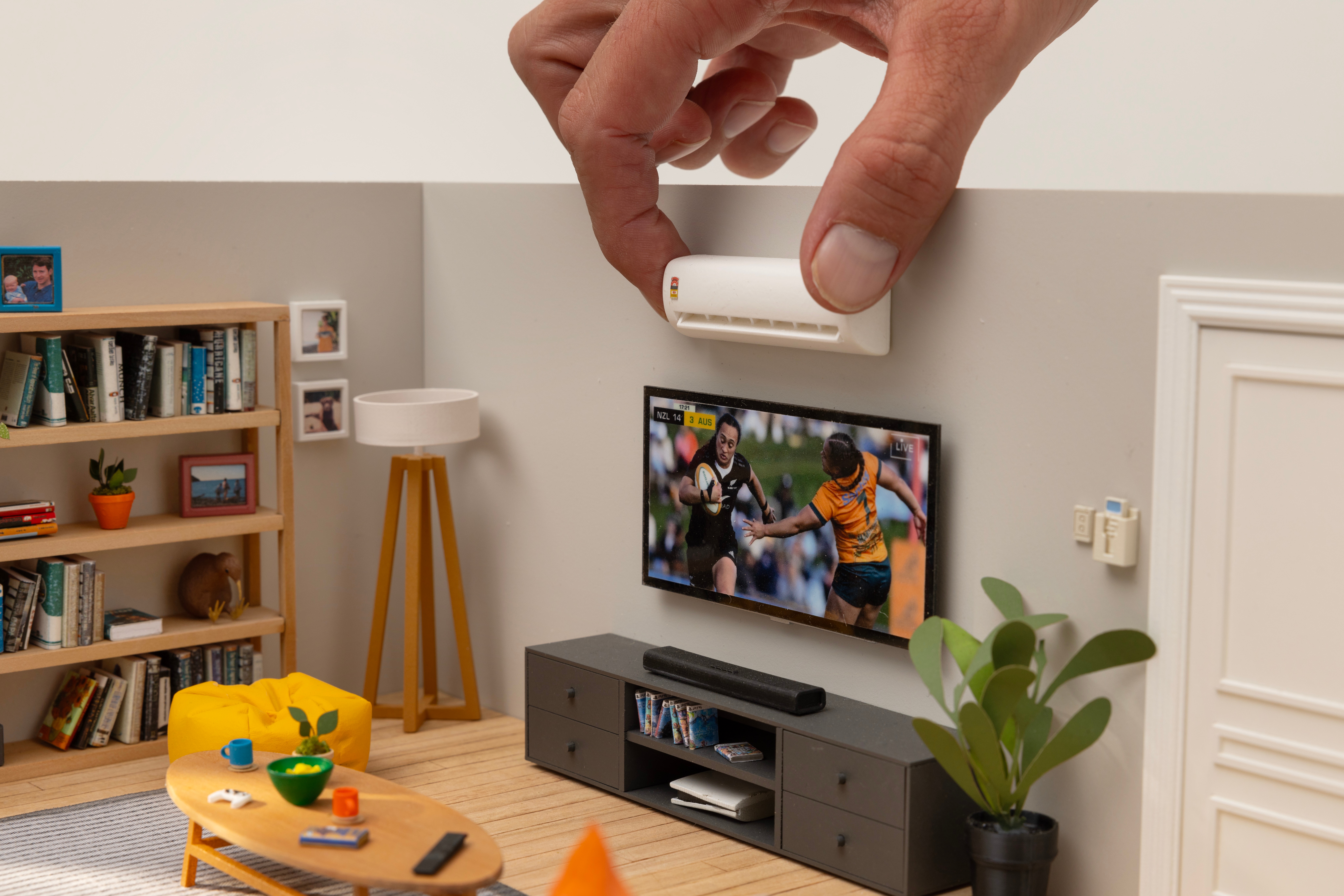 Hand adjusts miniature heat pump