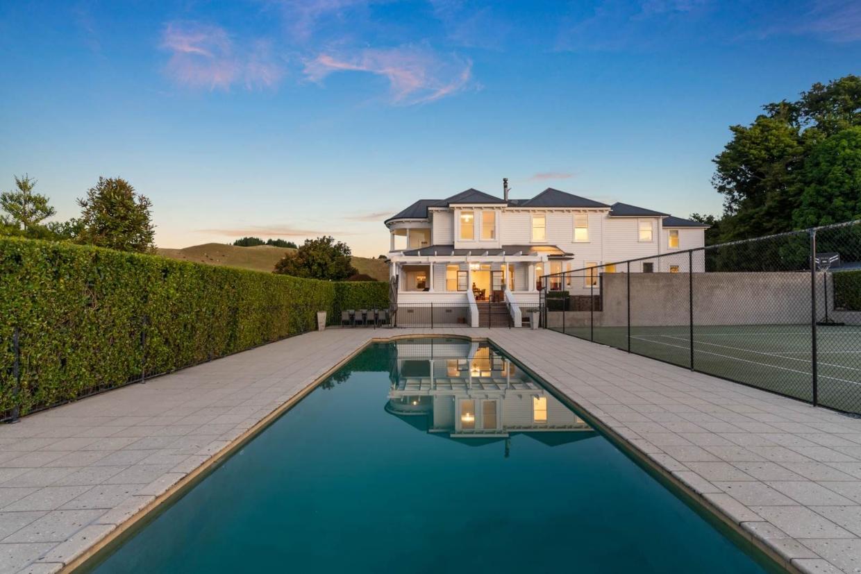 White Victorian mansion with pool 