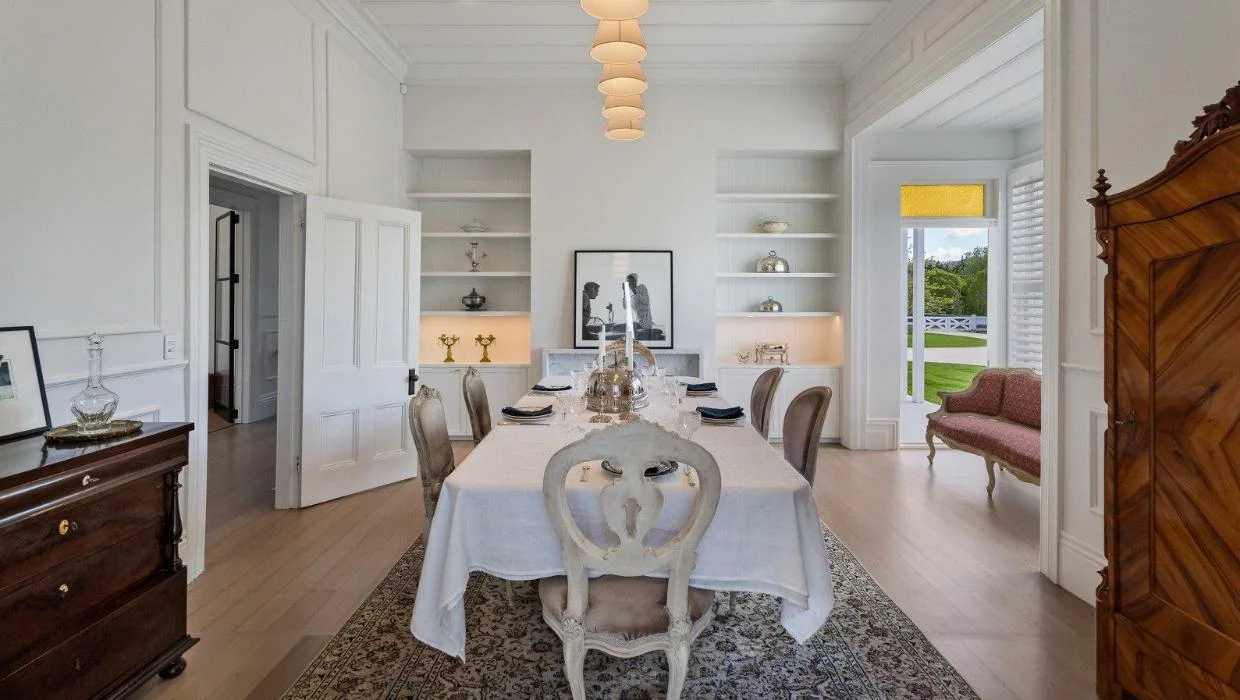 The formal dining room features a high ceiling stud and is light and airy.