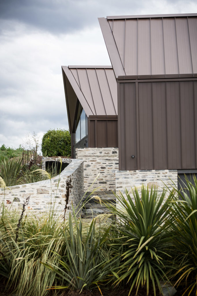 An alpine home in Queenstown with rooflines inspired by European mountain chalets