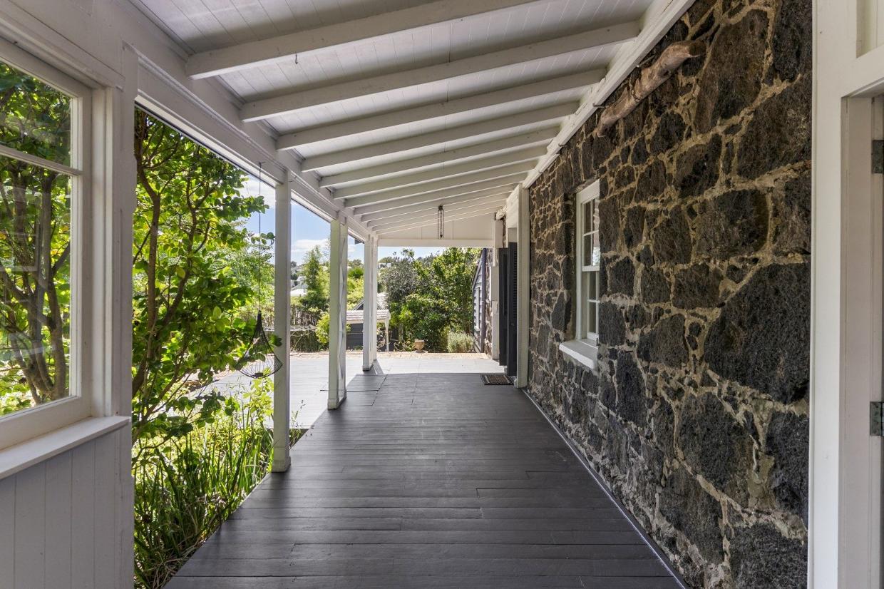 A stunning veranda runs the length of the house at the rear 