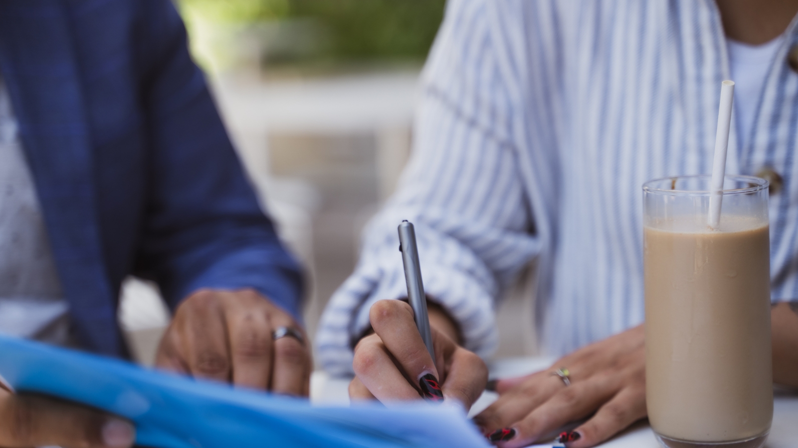 Two people looking at documents. 